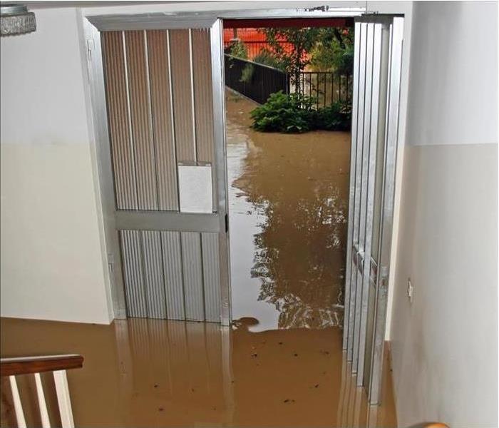 Floodwater enters a home